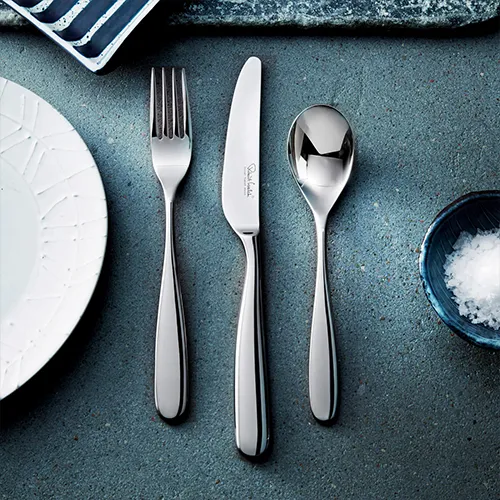 Cutlery set on blue background