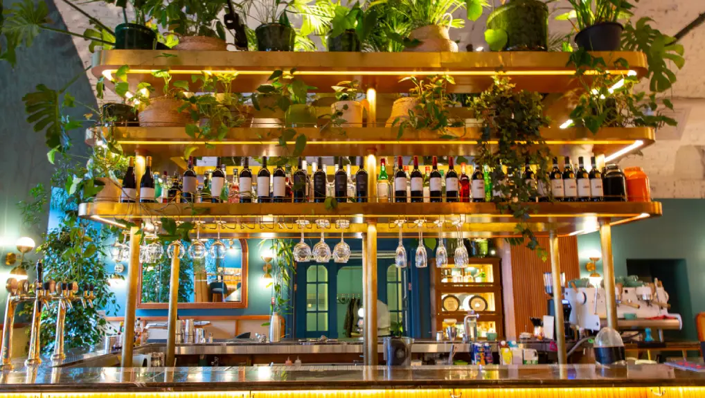 image of a well organised bar and layout neatly presented in a contemporary cocktail bar setting.