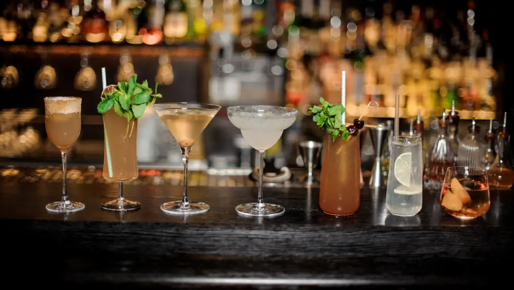 image of a bar with a selection of different essential bar glassware