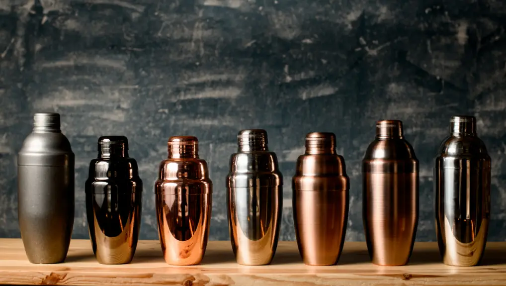 image of a collection of cocktail shakers in a contemporary bar setting ideal bar tools for beginners.