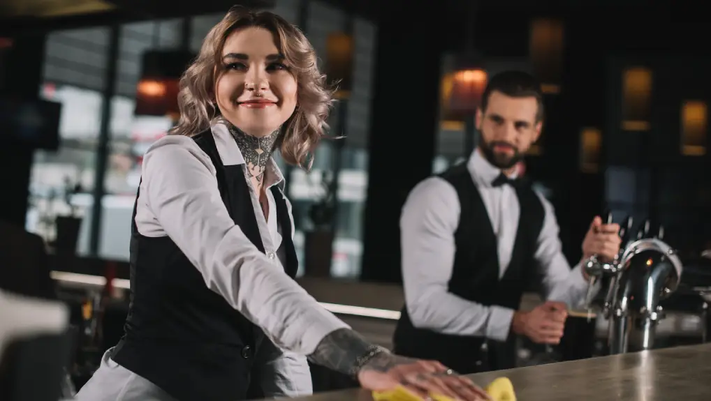 Image of two bartenders behind the bar