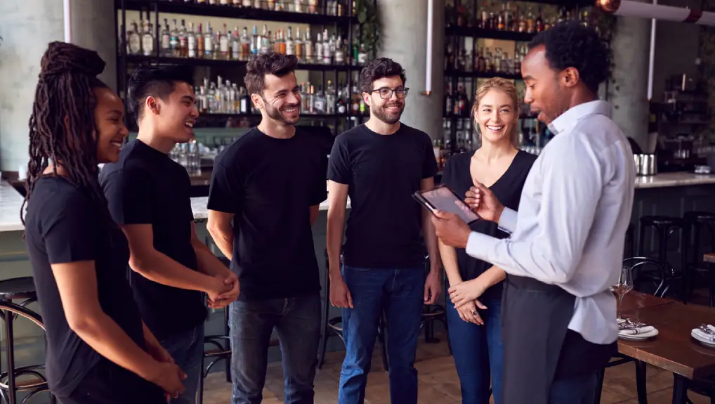 image of  a group of bar staff undergoing training in a newly set up bar.