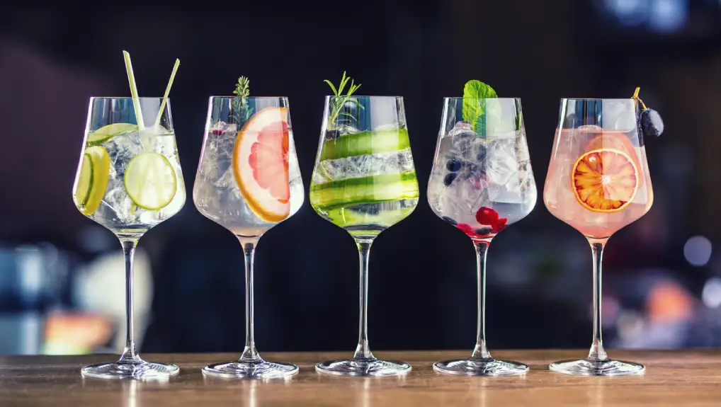 Close up image of five glasses with various cocktail mixes