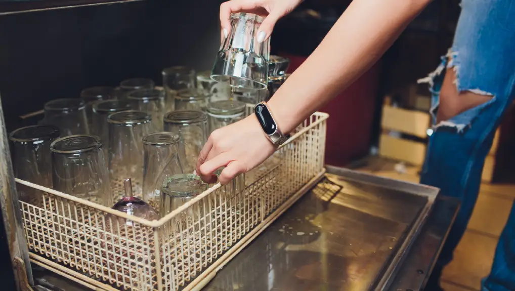 Close up image of a glass washer machine in a bar