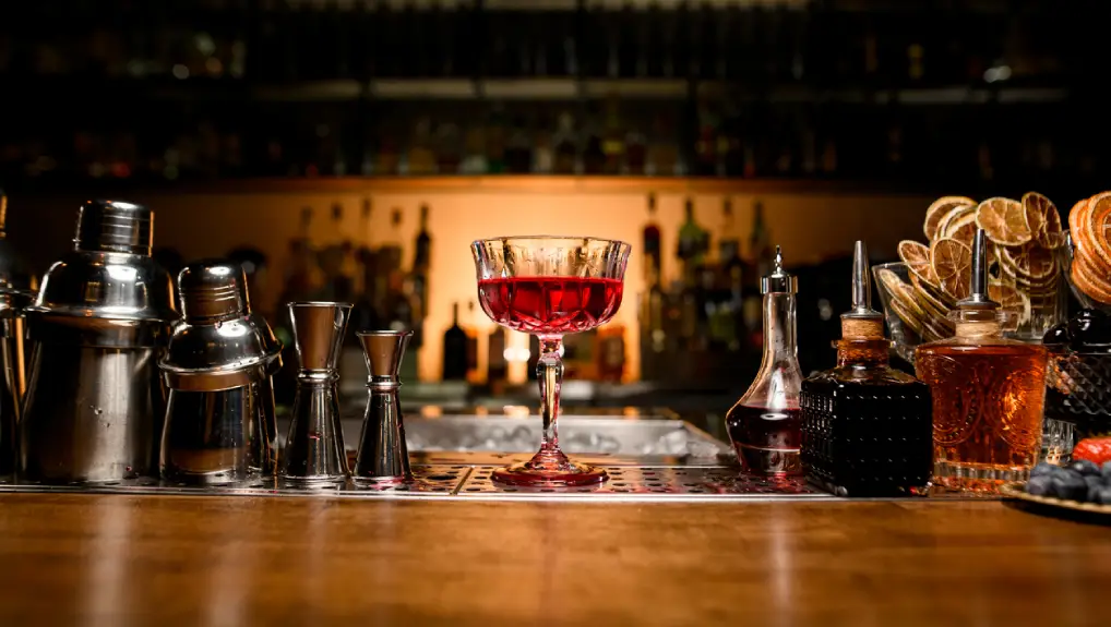 Close up image of a vintage cocktail bar with a history of bar tools