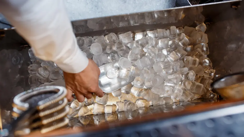 Close up image of tongs and scoops ice tools for small commercial bars